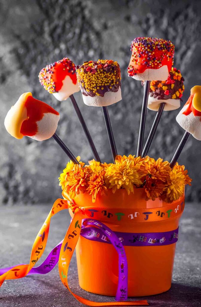 No-Bake Marshmallow Pops – Quick, Fun & Kid-Friendly halloween marshmallow pops displayed in a cute orange bucket