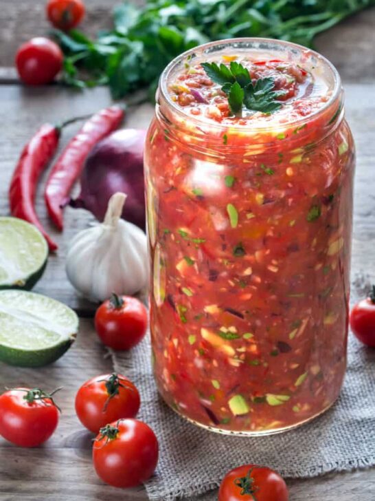 Jar of salsa with ingredients