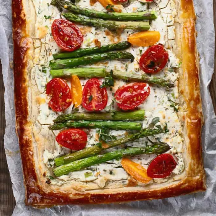 Puff pastry tart with asparagus and tomatoes.