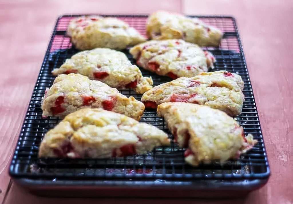 Strawberry Lemon Scones step 5: a batch of strawberry lemon scones cooling on a wire rack after being baked in the oven