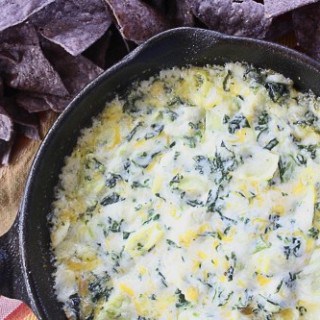 This recipe for Easy Spinach Artichoke Dip takes just a few minutes to throw together. A great appetizer that's hot and cheesy with a ton of flavor!