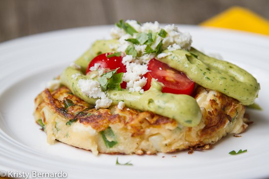 These Mexican Mashed Potato Cakes with Avocado Sauce & Cotija Cheese are perfect party food or a light dinner! A great way to use up leftover potatoes, too.