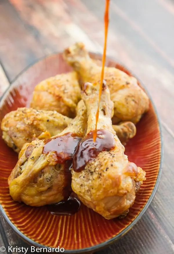 Crispy Asian Chicken Drumsticks - an easy meal! Crispy chicken drumsticks are tossed with a killer 5-minute asian sauce - incredibly delicious.