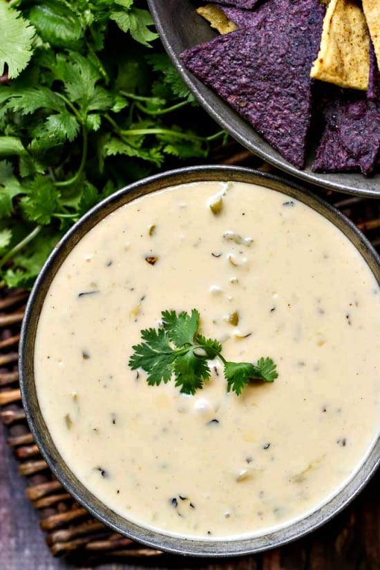 An easy, flavorful queso dip that's great alone or add green chiles for even more flavor - hatch, poblano or even canned!