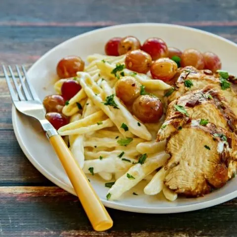 Balsamic Chicken with Goat Cheese Pasta & Roasted Grapes - Everyone needs an easy, upscale dish for entertaining or a special occasion. All the components of this delicious dish come together quickly and the flavor is out of this world!