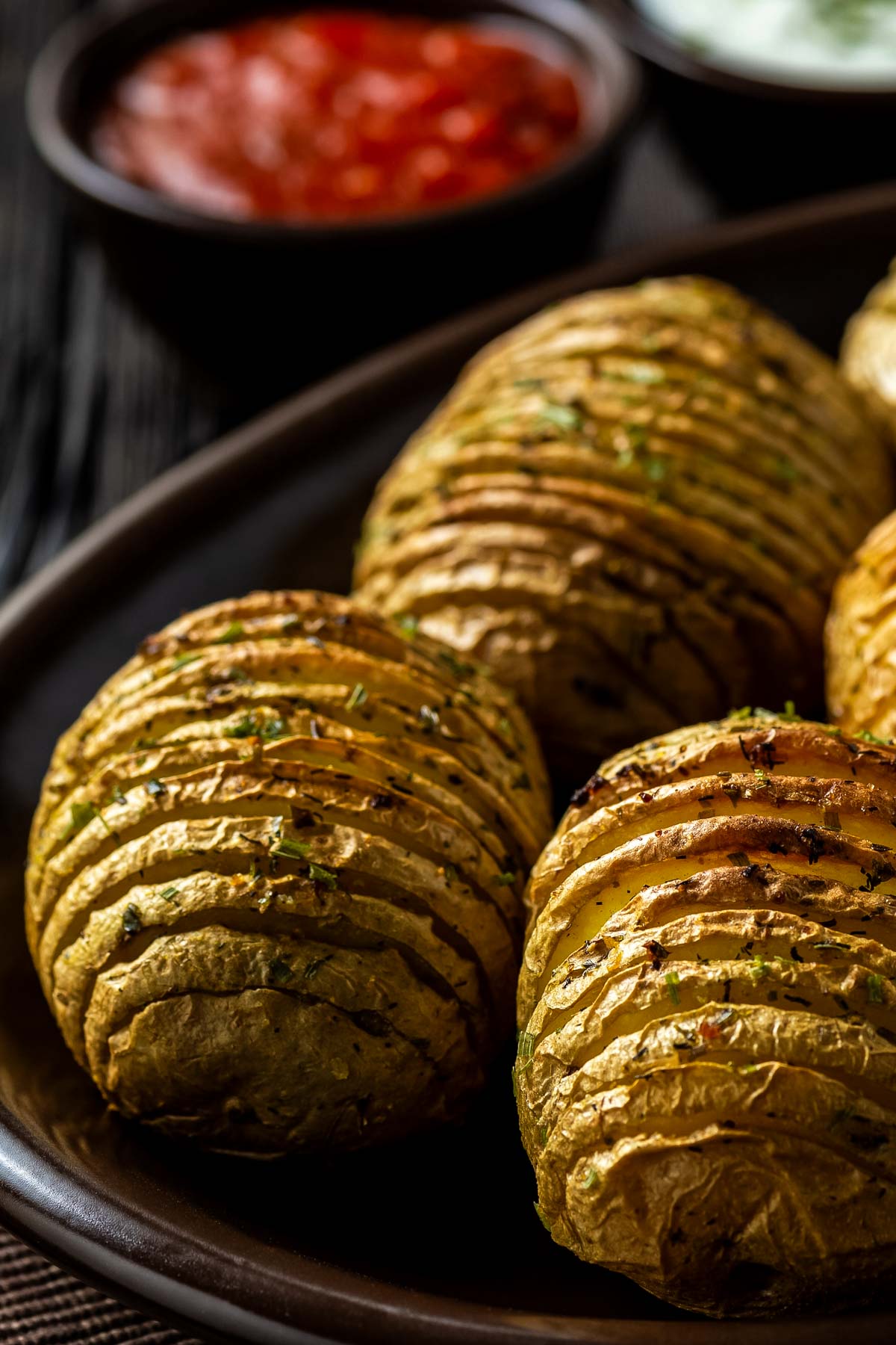 a plate of hasselback potatoes