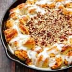 {ONE-PAN} Skillet Cinnamon Rolls with Salted Caramel & Pecan Cream Cheese Dip - the hot caramel cream cheese dip is heaven with the soft, warm cinnamon rolls!