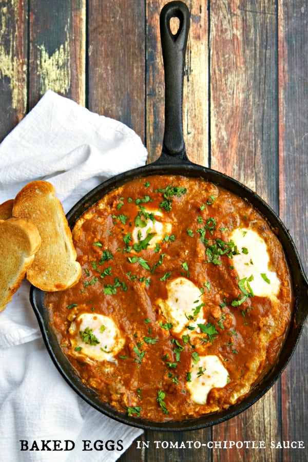 Baked Eggs Recipe in Tomato Chipotle Sauce - SO EASY!! The sauce is to die for and can be used in all types of dishes (over pasta,, for one)! Easy to freeze it, too, then just toss in your skillet, crack the eggs and breakfast is done! Can be made over a campfire, too!
