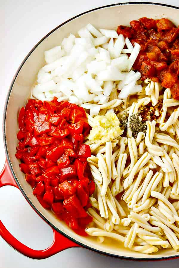 One Pot Pasta with Roasted Red Peppers, and a creamy Goat Cheese sauce! Just toss your ingredients into the pot with your UNCOOKED pasta and go!