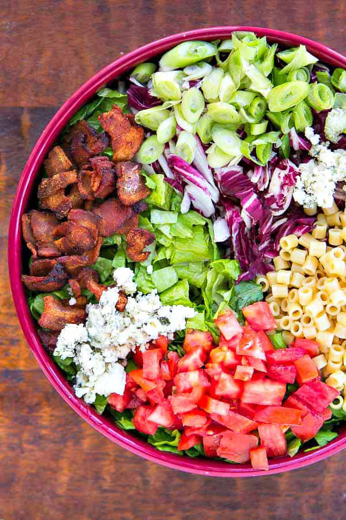 Portillo's Chopped Salad a serving bowl filled with the ingredients for a copycat portillos chopped salad before mixing and dressing