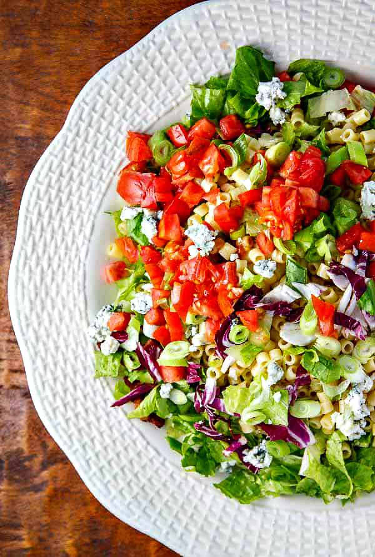 Portillo's Chopped Salad a large serving bowl filled with a tossed copycat portillos chopped salad just before adding the dressing