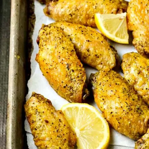 CRISPY Baked Lemon Pepper Chicken Wings! FOUR ingredients, so much FLAVOR! Double the batch, they go FAST!
