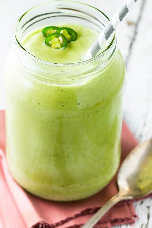 A Tropical Smoothie recipe with mango, banana and pineapple PLUS a surprising ingredient that adds protein and will make your smoothies SUPER creamy! (Includes two variations: with kale and SPICY with kale!)