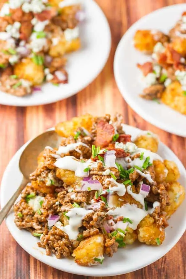 Blue Cheese Burger Totchos - all of your favorite flavors and ingredients from a Blue Cheese Burger served over tater tots for an easy, delicious dish that serves a crowd!