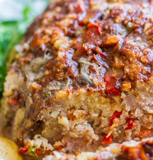 Delicious meatloaf with loads of veggies, shaved parmesan and a wonderful balsamic glaze! Crockpot meatloaf is so simple!
