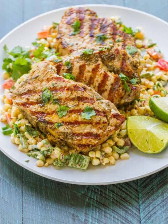 Grilled Boneless Pork Chops with Mexican Corn Salad. Healthy and SO flavorful! The easiest, most flavorful salad (I swear I could drink the dressing)!