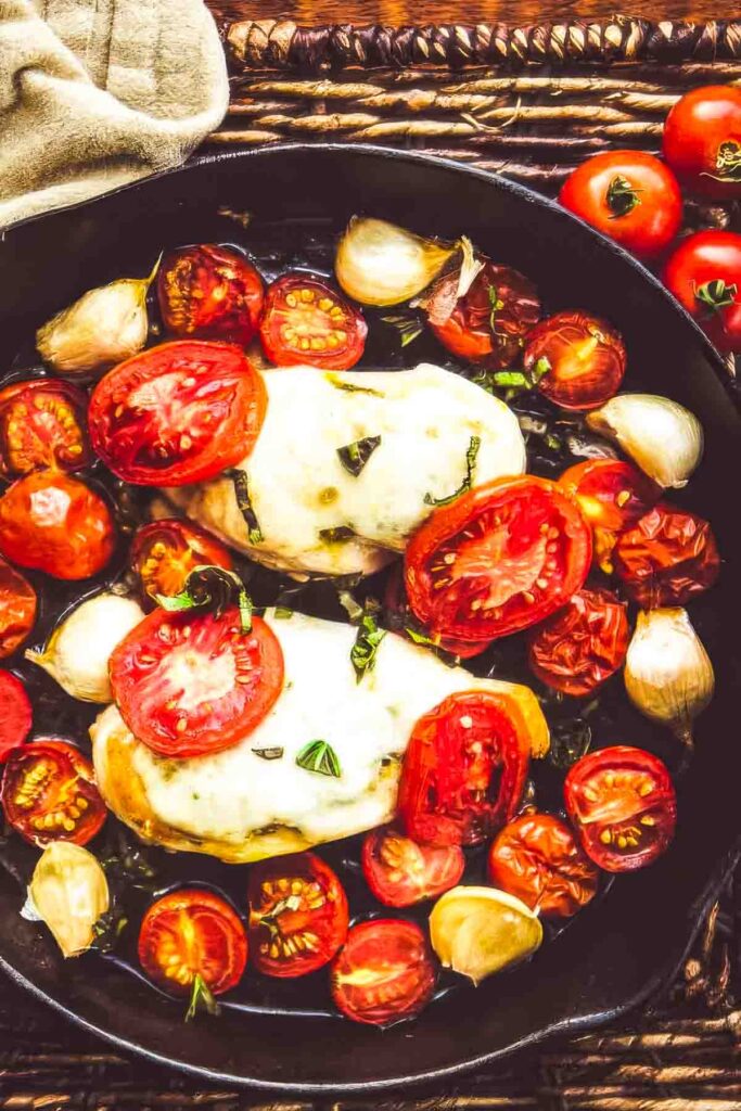 Air Chilled Chicken: Why It’s Better + A Recipe a closeup of tomato basil chicken fresh out of the oven
