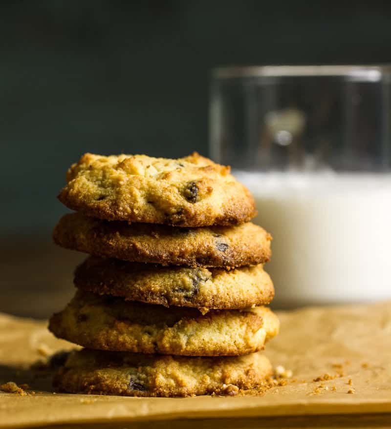 A stack of keto chocolate chip cookies next to a glass of milk | Low carb chocolate chip cookies