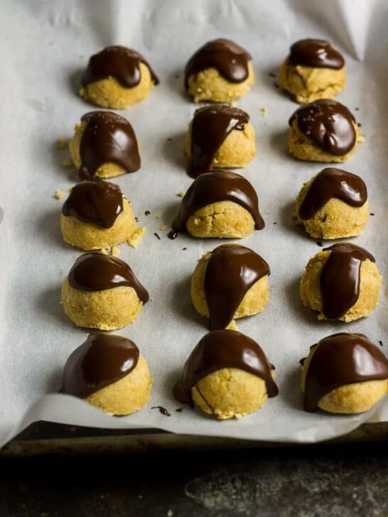 Keto Cookie Dough | Peanut Butter Cookie Dough bites just after being coated in chocolate