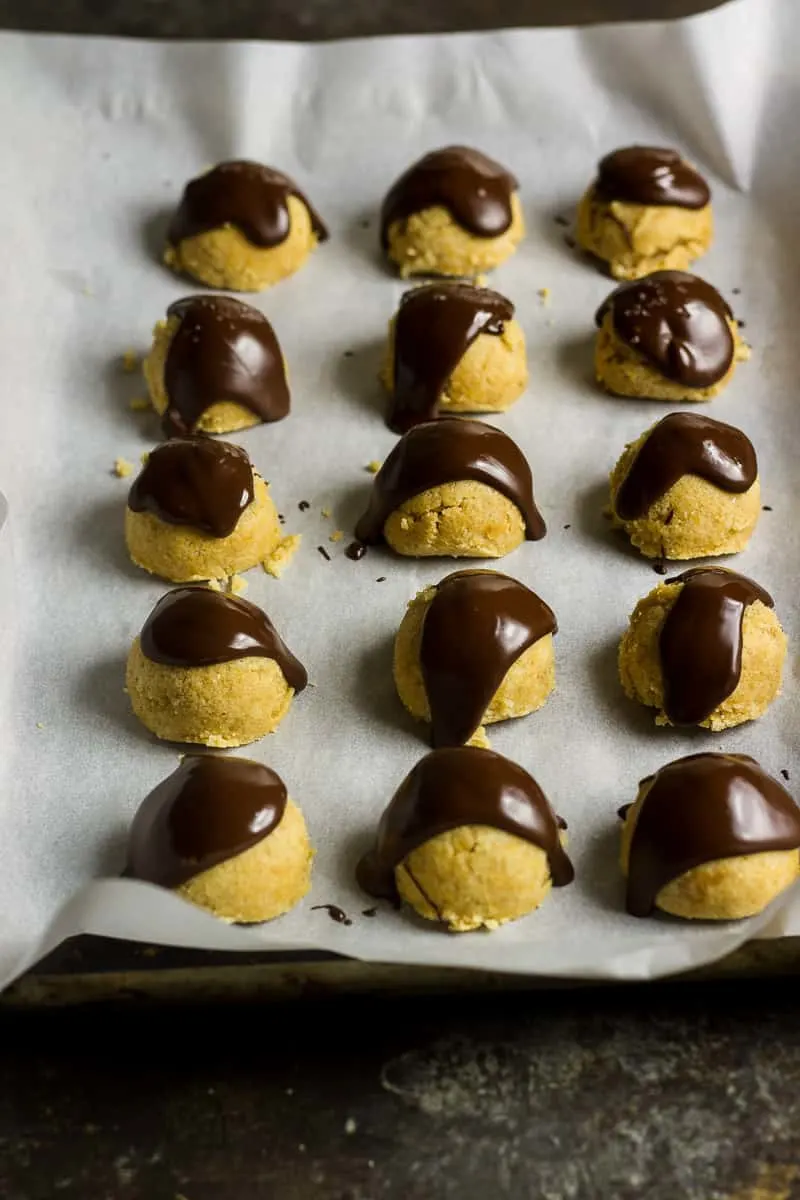 Keto Cookie Dough | Peanut Butter Cookie Dough bites just after being coated in chocolate