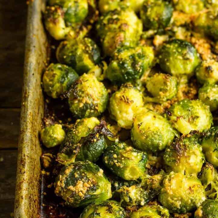 Roasted Smashed Brussels Sprouts and mashed on a sheet pan
