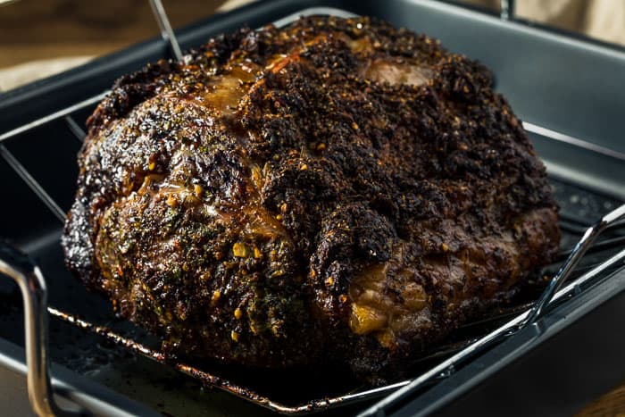 How to cook a boneless prime rib roast in the oven. A boneless prime rib roast just out of the oven, ready to be carved.