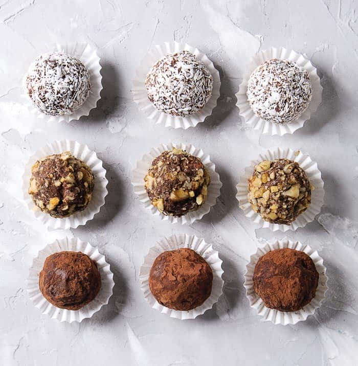 Homemade chocolate truffles in white paper candy cups for gift-giving