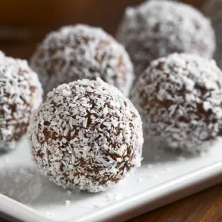 coconut rum balls on a white plate