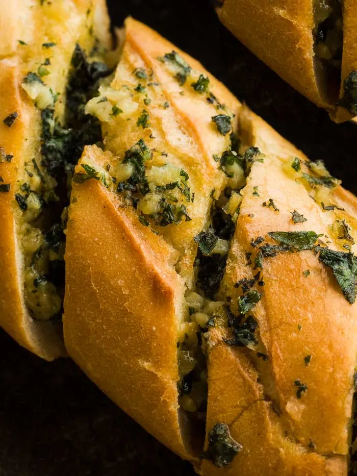 A closeup of stuffed garlic bread just out of the oven
