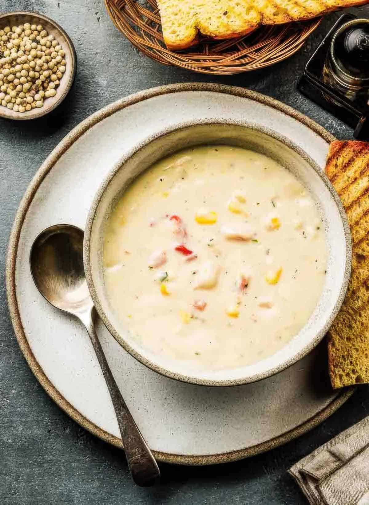 Seafood Chowder Recipe – Ready in 30 Minutes a hearty bowl of chowder with a slice of grilled bread, the end result of making a seafood chowder recipe