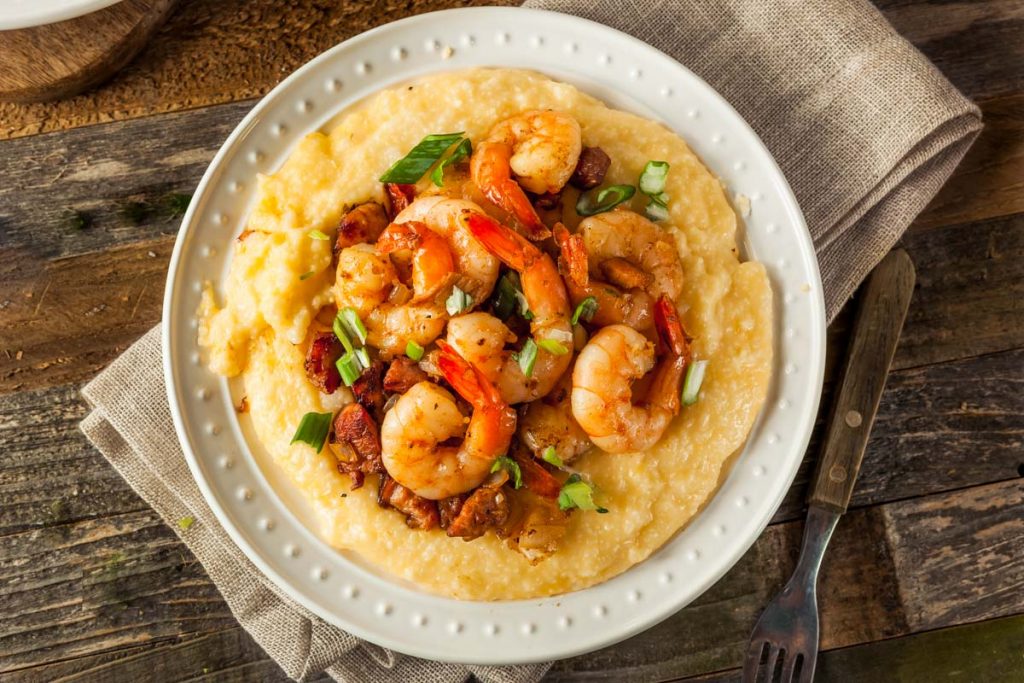 An overhead view of a bowl of Cajun Shrimp and Grits