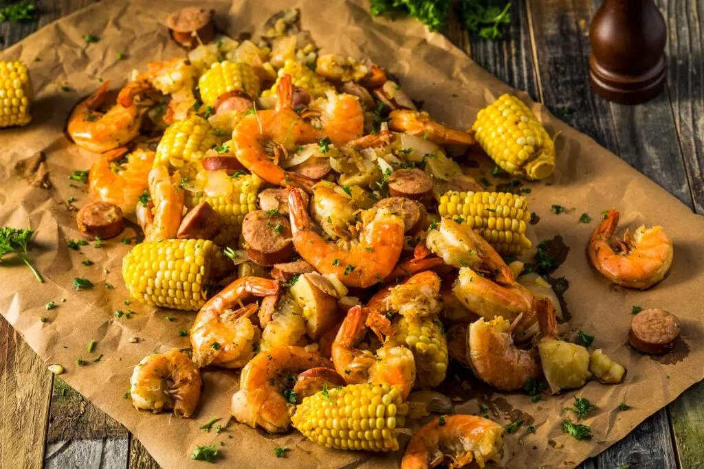 shrimp and sausage boil on brown parchment paper from overhead