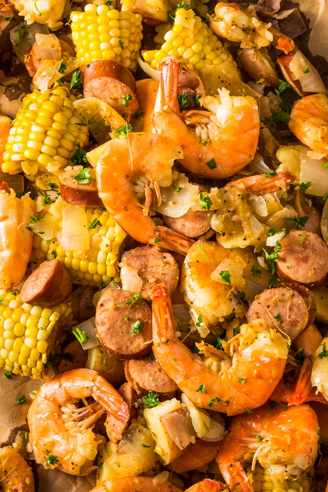 a closeup photo of shrimp and sausage boil