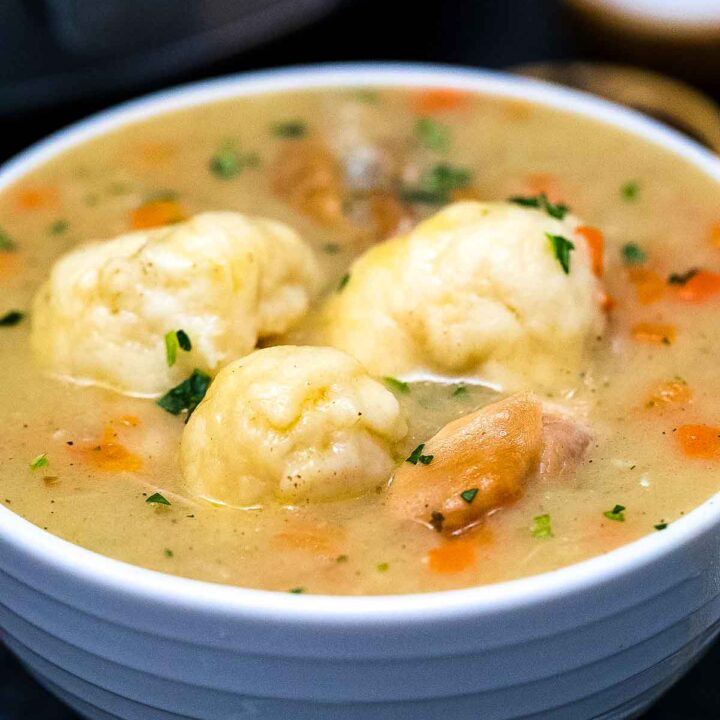 a bowl full of instant pot chicken and dumplings soup