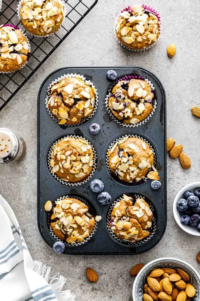banana blueberry oatmeal muffins in a muffin pan just out of the oven