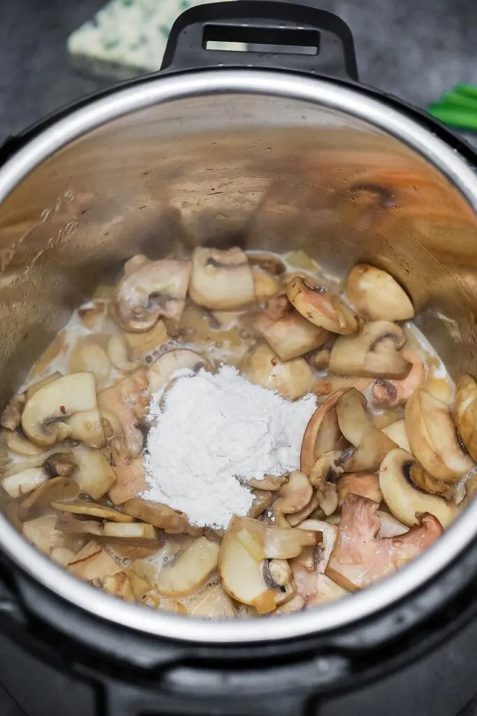 adding flour to an instant pot for beef stroganoff