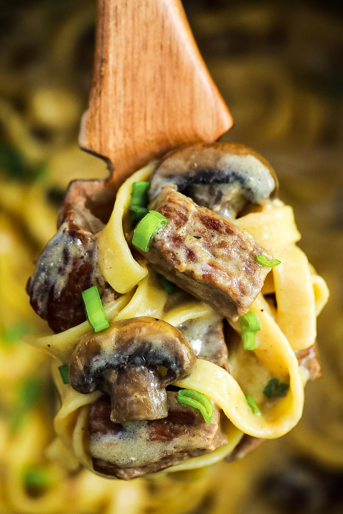 A Closeup of a Plate of Instant Pot Beef Stroganoff with Blue Cheese and Chives