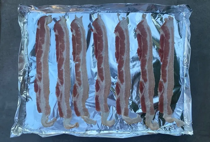 Bacon Ready to be Grilled on Foil Surface