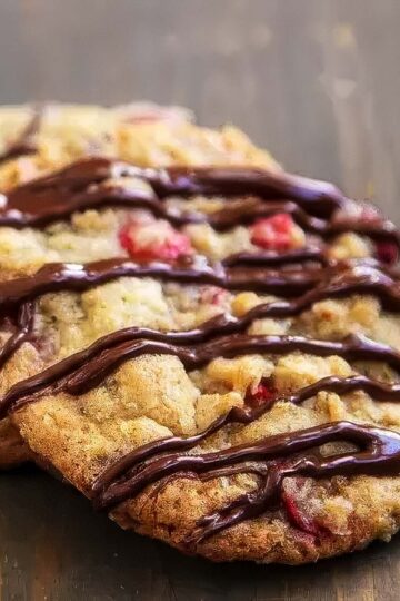 Cranberry Oatmeal Chocolate Chip Cookies cranberry oatmeal chocolate chip cookies that have just been drizzled with melted chocolate