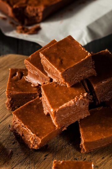 Easy Chocolate Fudge (3-Ingredients, microwave, no-Bake) a side view of a stack of easy chocolate fudge