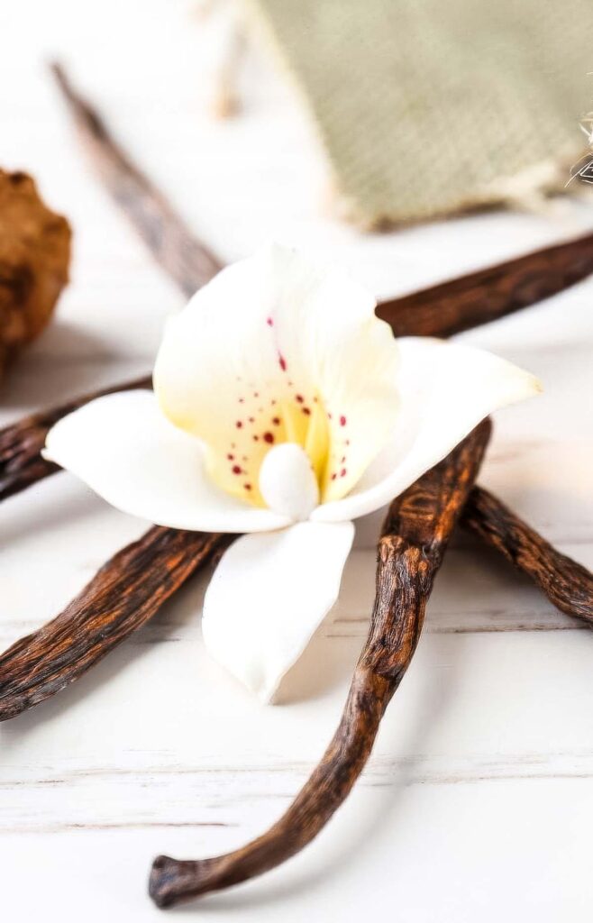 The Best Vanilla Extract Substitutes for Baking and Cooking vanilla beans on a marble countertop as a substitute for vanilla extract