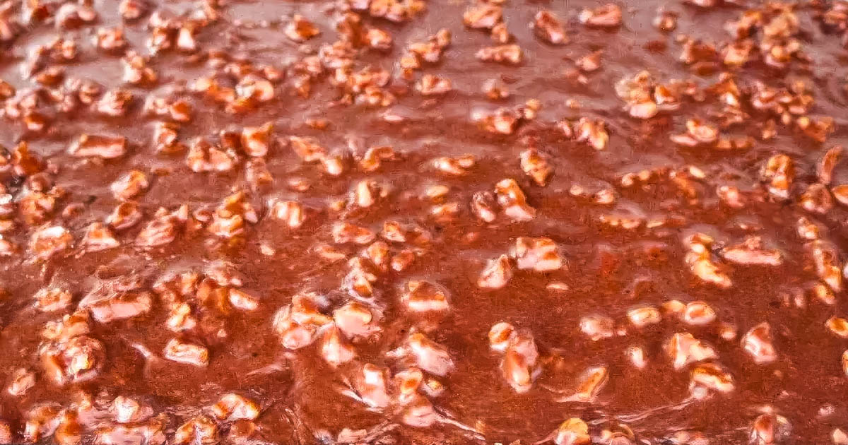 Buttermilk Texas Sheet Cake a closeup of a texas sheet cake with buttermilk cooling on the stove