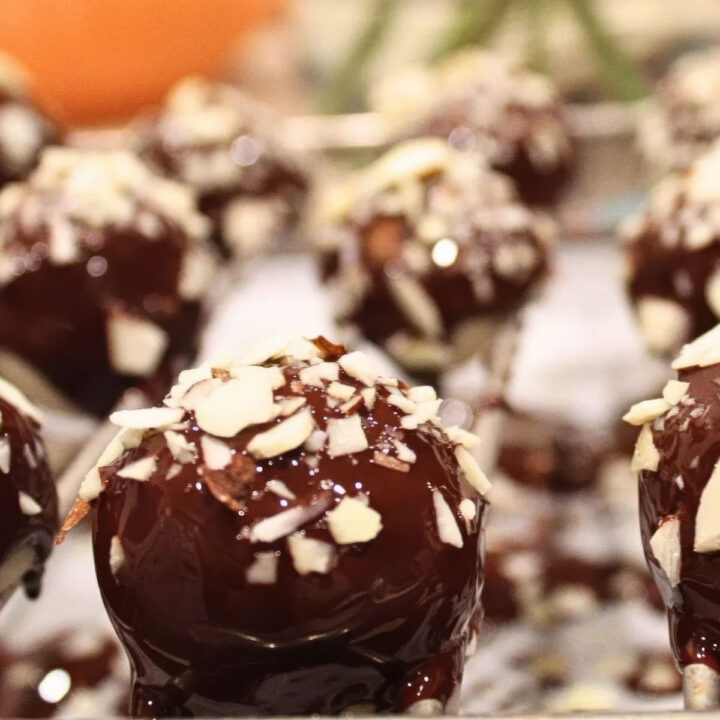 a tray of marzipan chocolate topped with slivered almonds