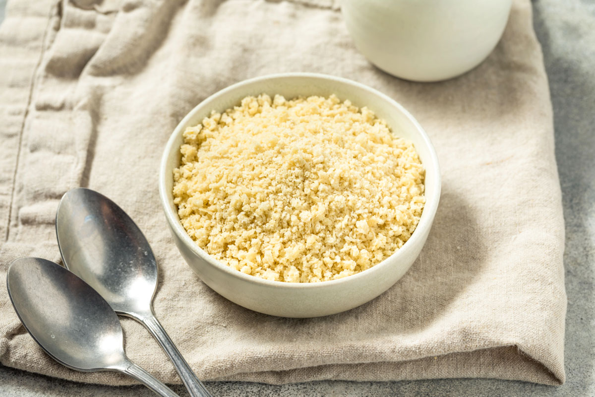 Homemade Panko Breadcrumbs a small bowl of homemade panko breadcrumbs on a tan linen napkin next to two spoons