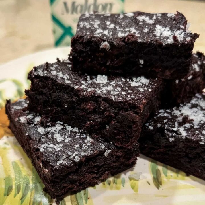 a plate of chocolate banana brownies topped with maldon salt