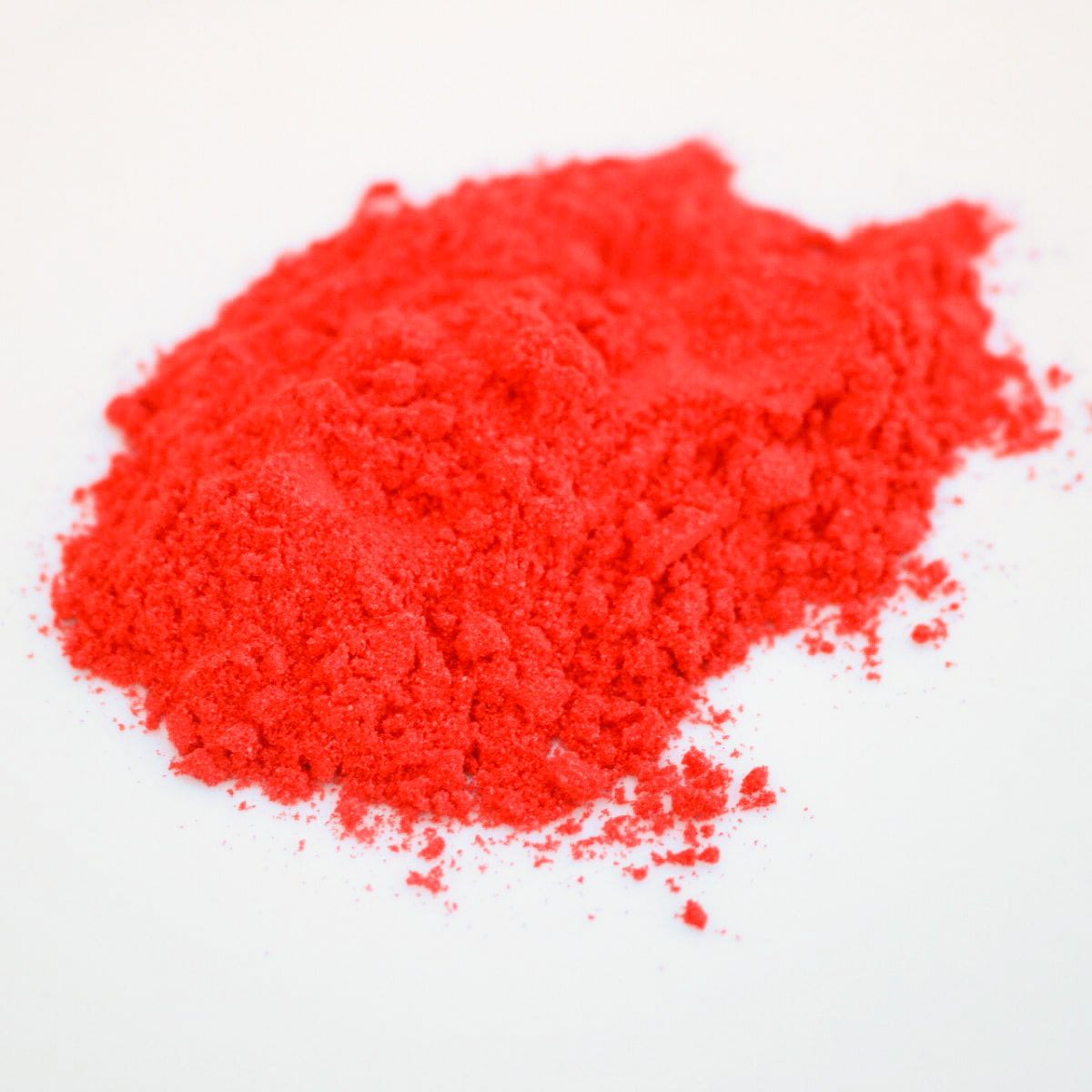 a small pile of flamin hot cheetos seasoning copycat on a white background