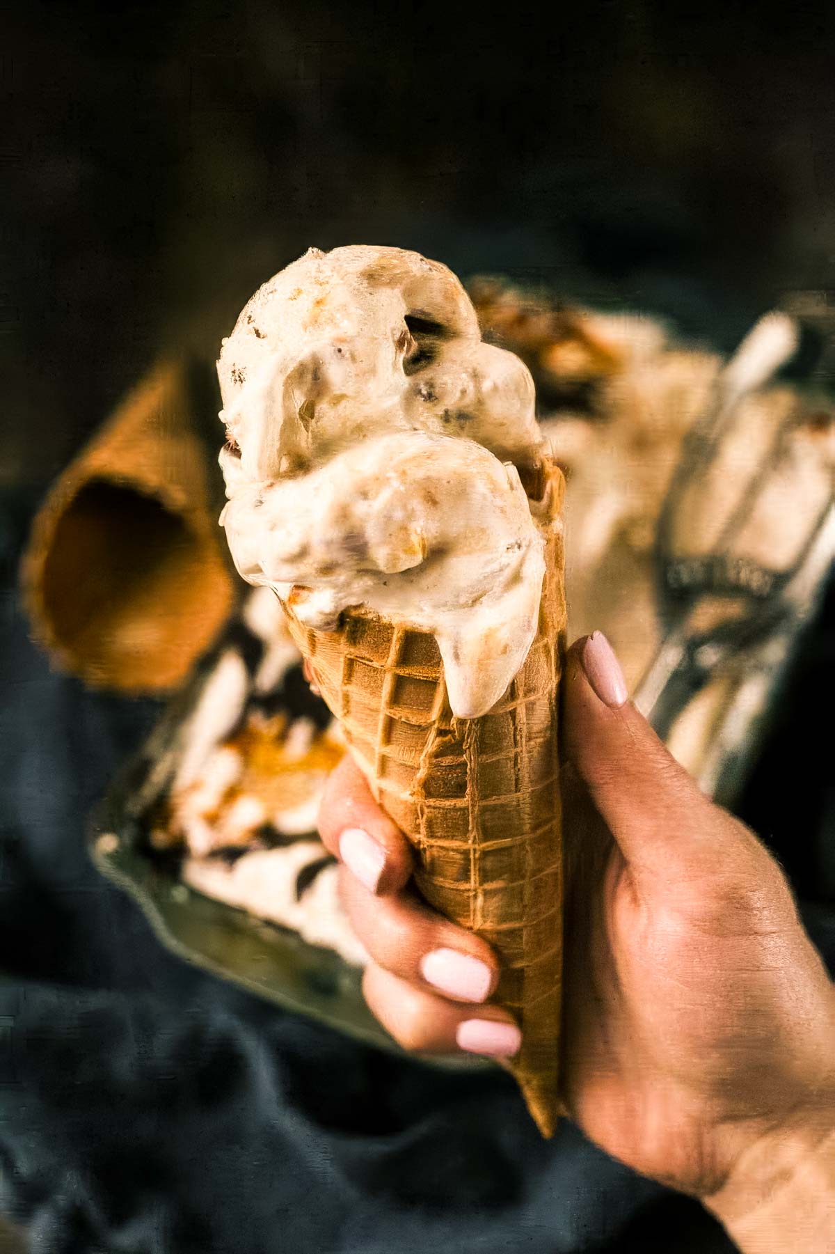 Chunky Monkey Ice Cream Recipe (No-Churn!) a two-scoop ice cream cone filled with chunky monkey ice cream