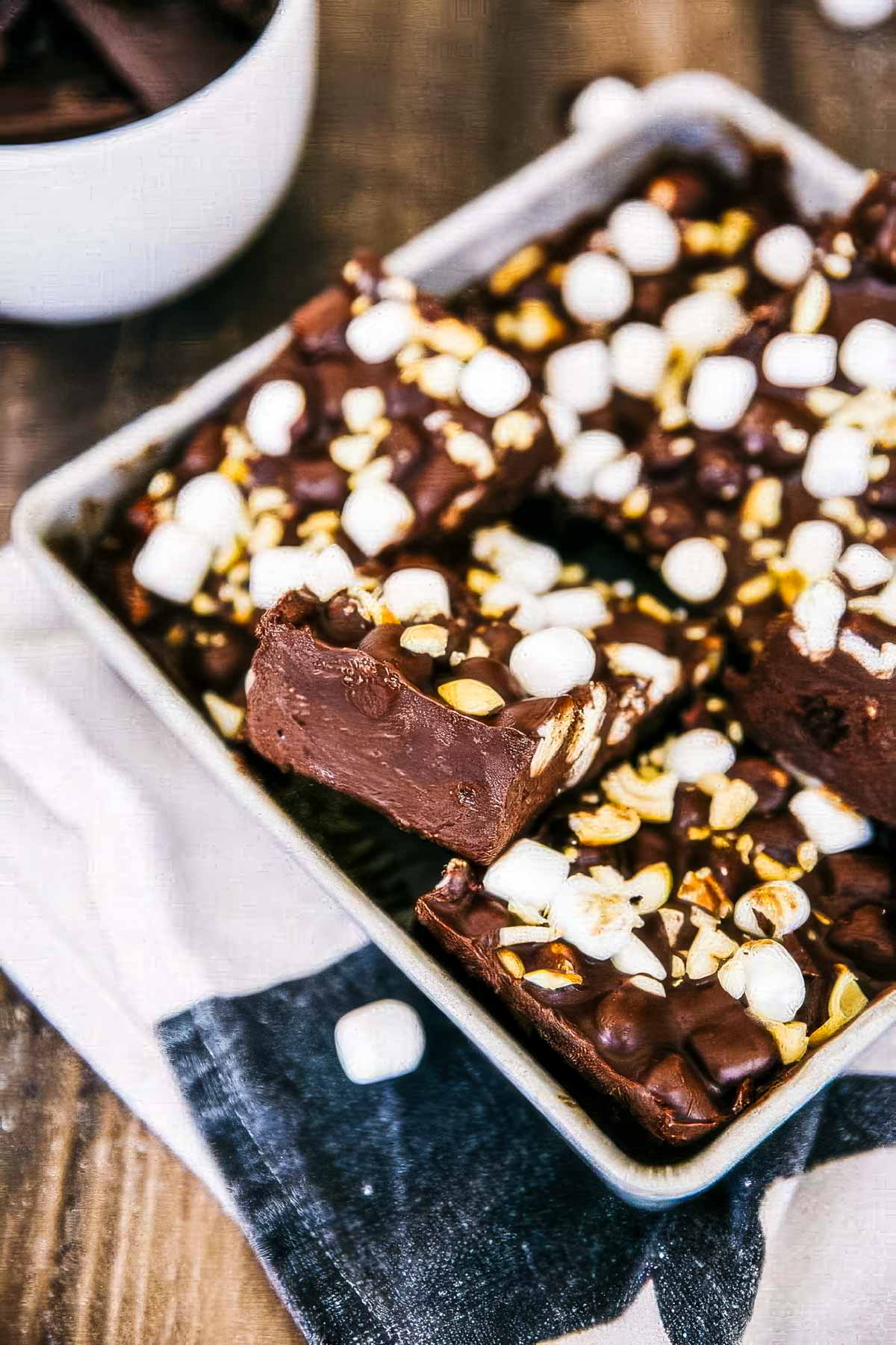 No-Bake Rocky Road Bars with Cashews a baking pan filled with slices of rocky road bars
