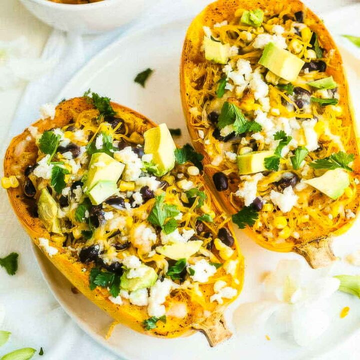 two mexican spaghetti squash on a white plate