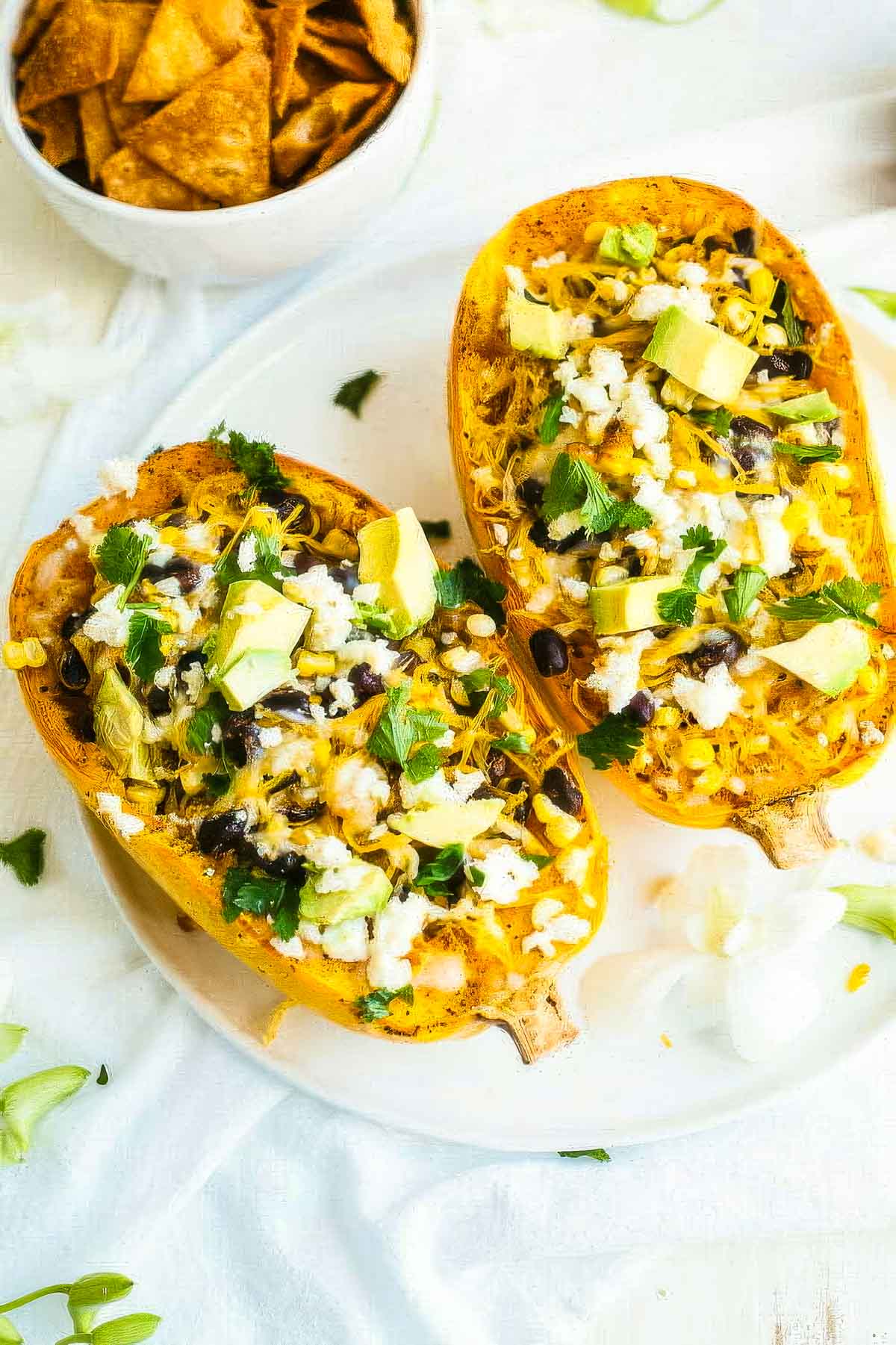 Mexican Spaghetti Squash two mexican spaghetti squash on a white plate